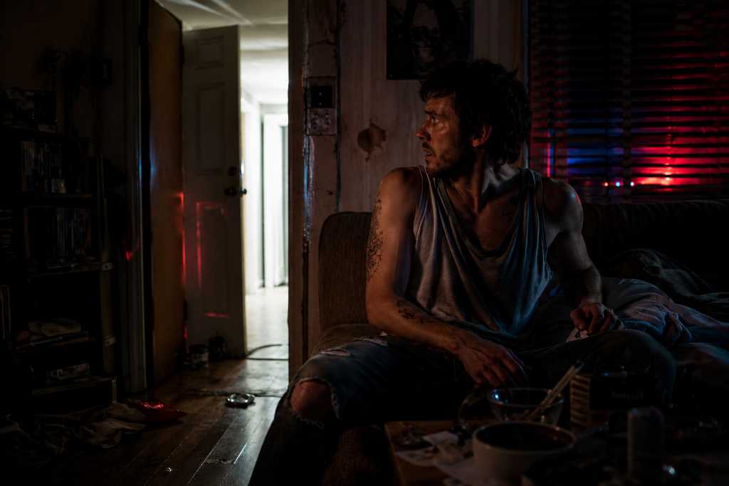 Drug Abuser in a cluttered room