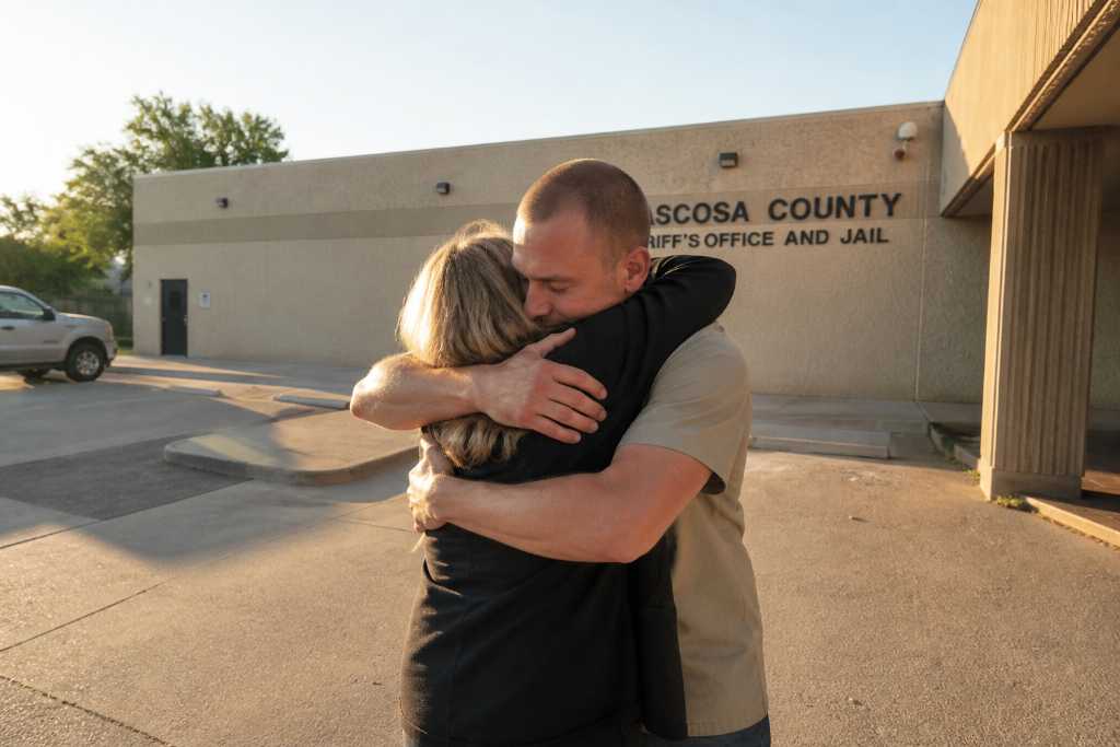 Hugging outside the Atascosa County Sheriffs Office and Jail